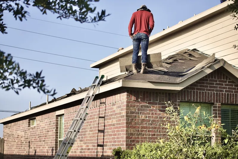 Professional roofer working on a residential roof in Downtown Agoura Hills